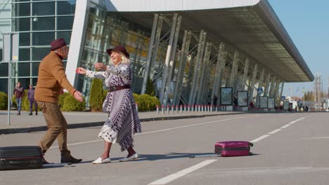 senior old husband and wife retirees tourists reunion meeting in airport terminal after traveling