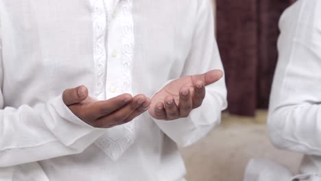 close up shot of indian muslim man reading namaz