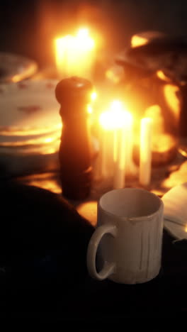 empty mug on a table with candles