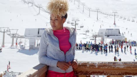 Trendy-young-woman-at-an-alpine-ski-resort