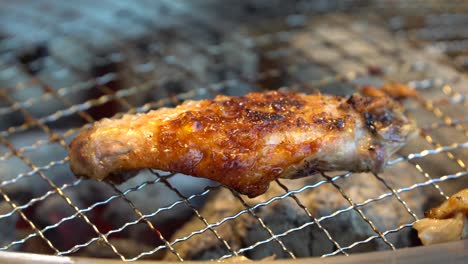 roasting delicious korean chicken barbecue -close up