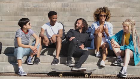 stylish young friends chatting on street