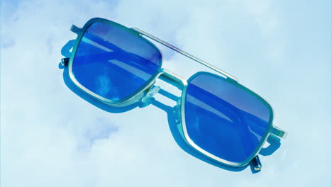 mirrored sunglasses reflecting clouds