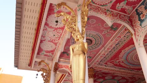 colorful paintings on the interior of pha that luang golden stupa buddhist temple in vientiane, laos