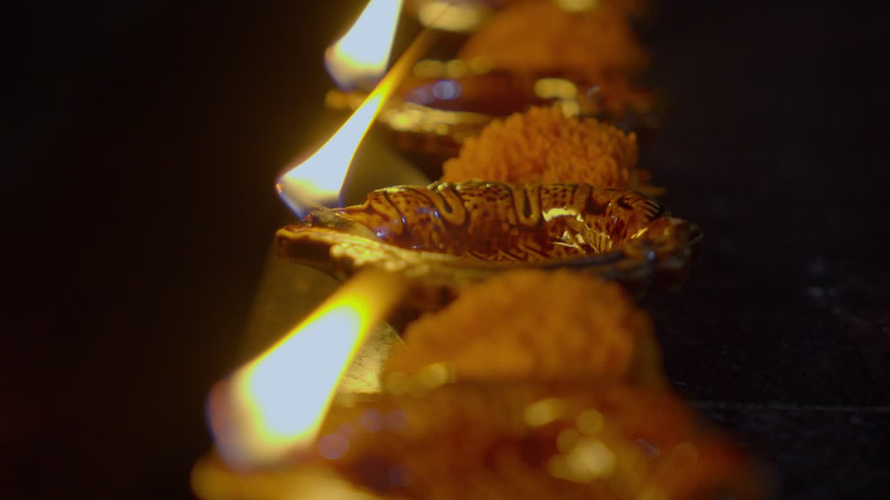 Diya lamps lit during Diwali celebration of Indian Hindu Light Festival called Diwali, rengoli decoration during deepavali