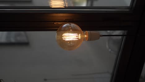 close-up of a glowing edison bulb with visible filaments