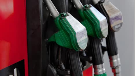 Row-of-three-fuel-pumps-in-stand-at-petrol-station