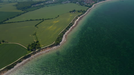 Baltic-sea-coastline-in-Brodten,-Germany,-high-aerial-drone-view-of-vast-background-German-countryside-landscape,-day