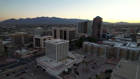 aerial push in to tucson arizona skyline at sunrise