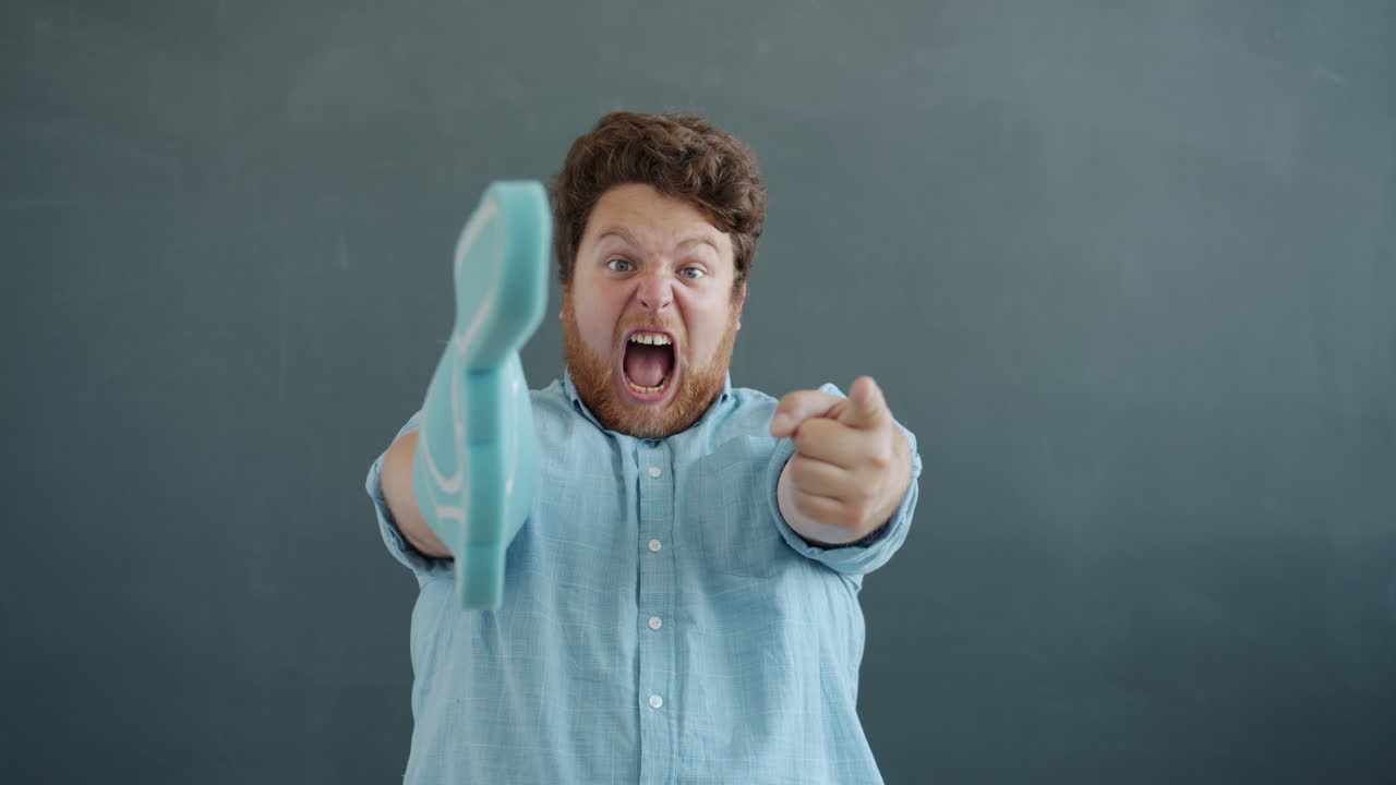 Angry Man Holding Cleaning Glove