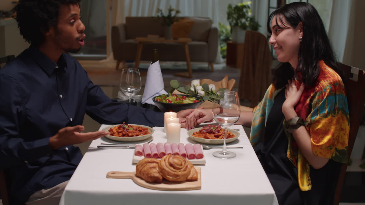 Man Having Romantic Dinner with Girlfriend at Home