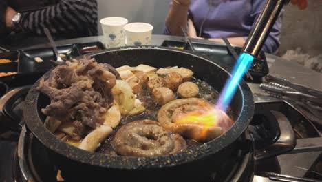 experience the sizzling spectacle of traditional korean cooking as pork internal organs