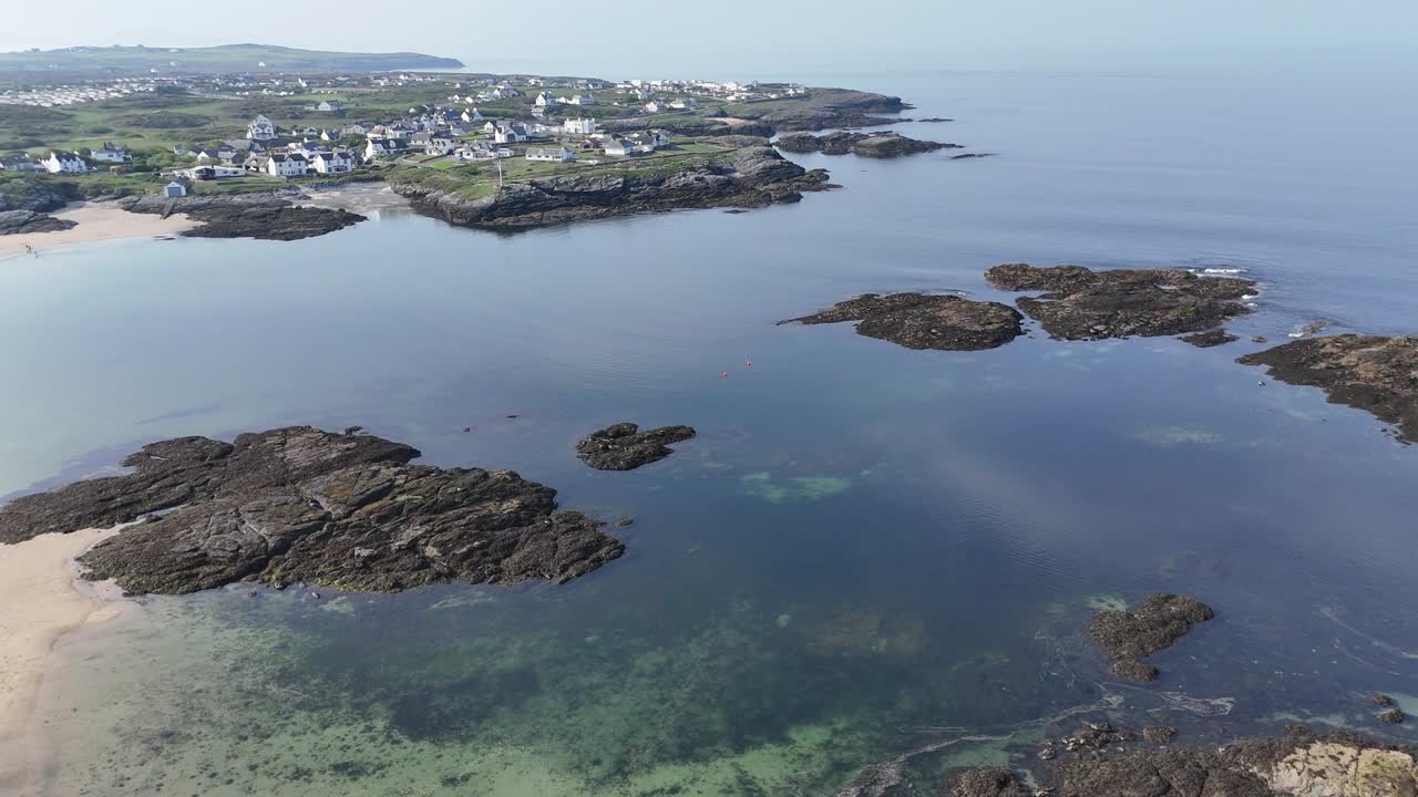 Aerial View of Coastal Village and Rocky Coastline