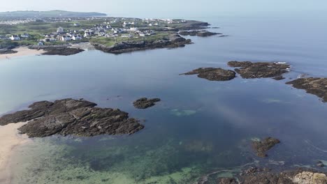 aerial view of coastal village and rocky coastline