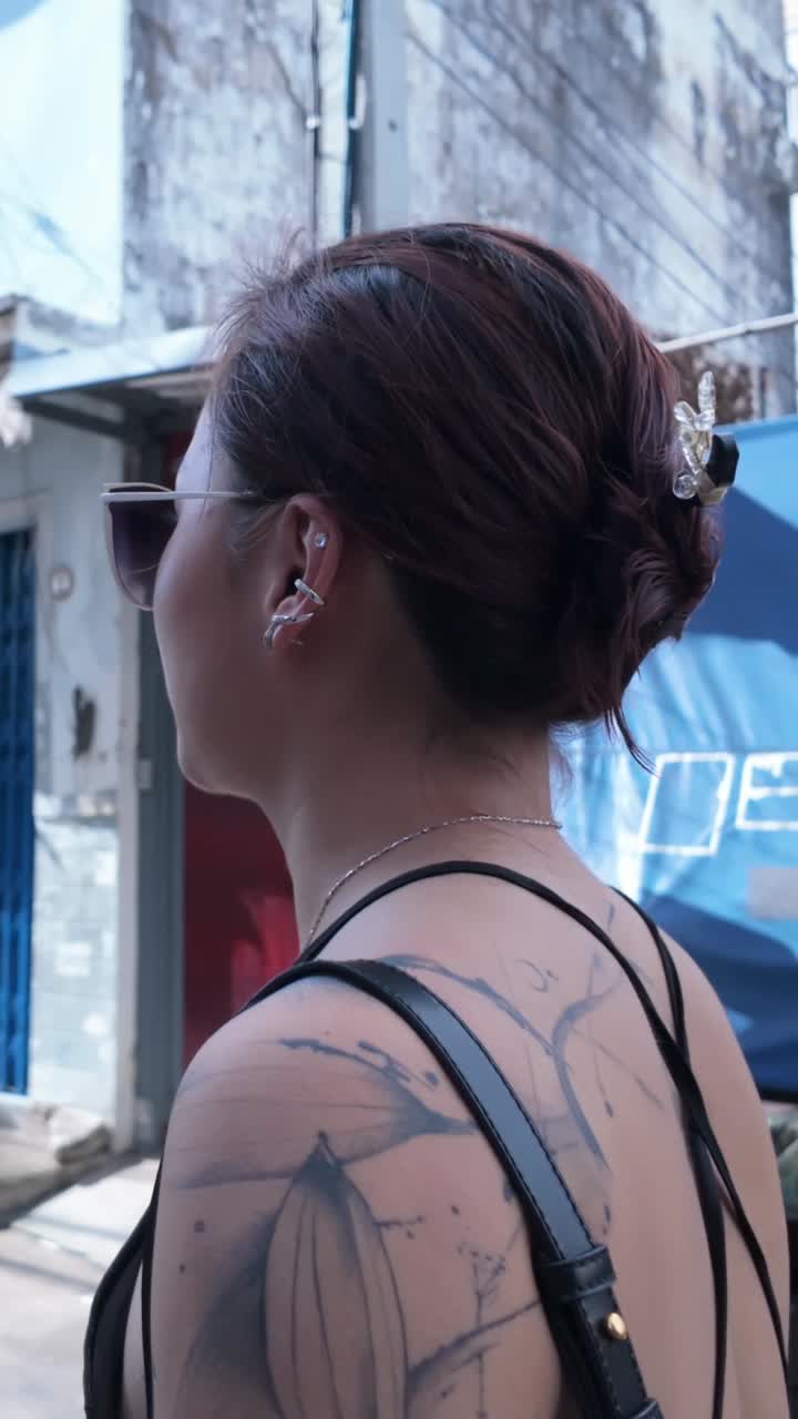 Woman with tattoos in urban setting