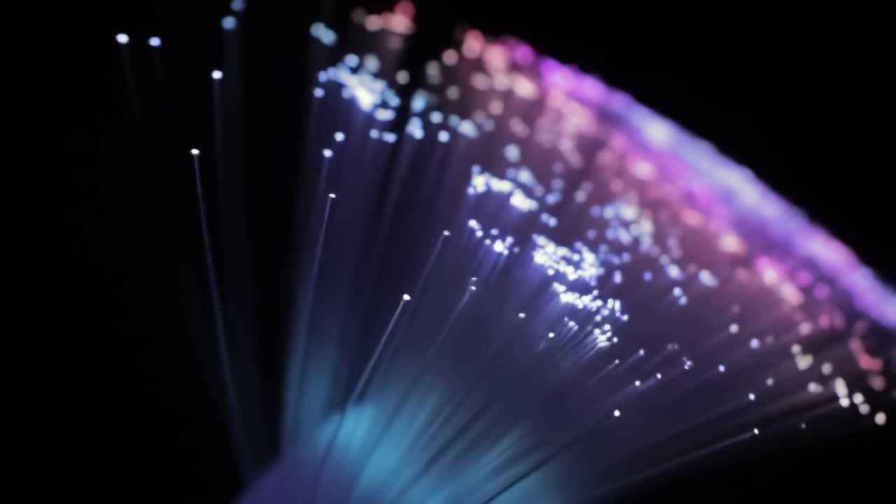 A dazzling array of light emerges from fiber optic strands creating mesmerizing patterns and colors that captivate the viewer. The play of illumination highlights the beauty of technology.