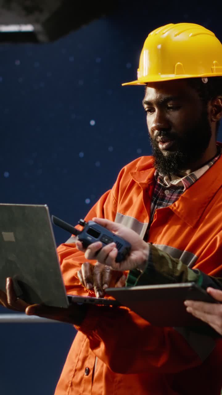 Vertical Video Professional military operative communicates via radio on offshore platform