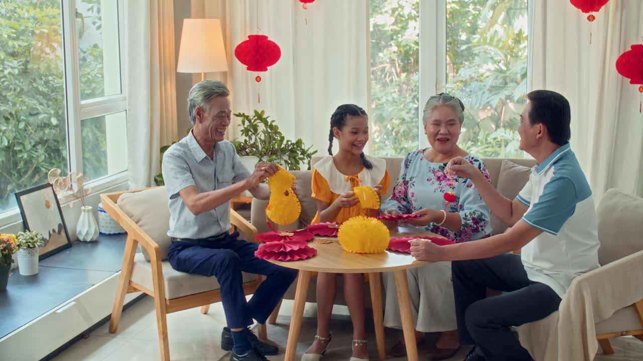 Asian Family Doing Decorations for Tet celebration