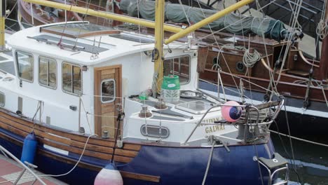 Pan-over-a-boat-tied-away-in-the-dock-at-Galway-City-with-no-one-on-board-and-an-empty-cabin