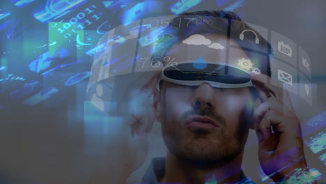 vestido con auriculares vr, hombre interactuando con una interfaz digital futurista que muestra varios iconos