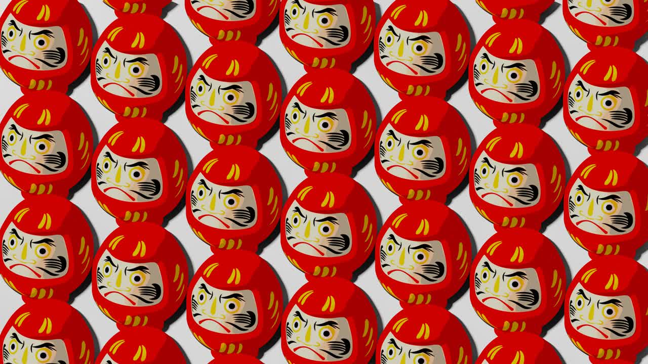 muñecas rojas de daruma sobre un fondo blanco.