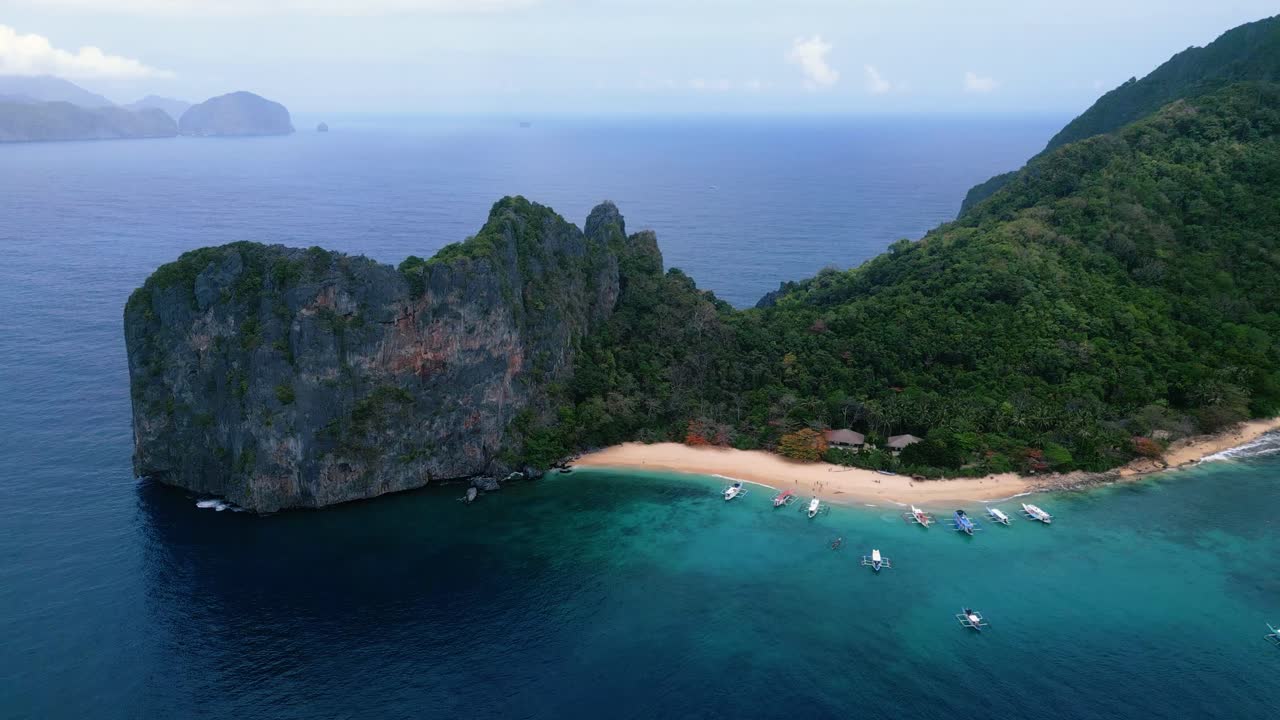 Cinematic Aerial Drone Flyover of El Nido Islands in Palawan, Philippines – Horizontal Shot Featuring Clear Ocean, Limestone Cliffs and Remote Coastline