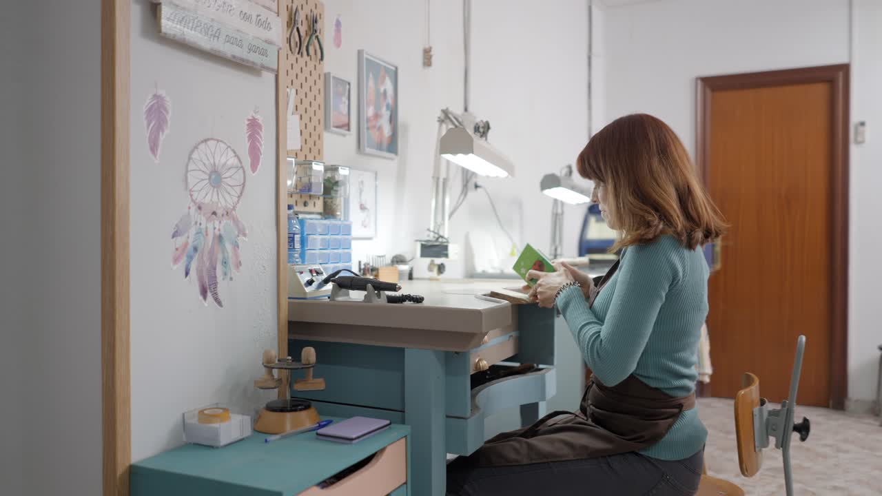 Woman Jeweler Working in Her Workshop