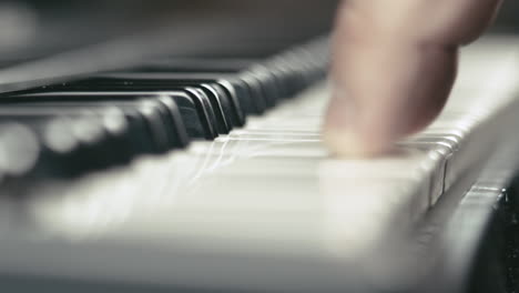 macro shot of a musician's hands while he plays keyboards