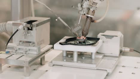 robotic welding cnc machine welding a microchip in a factory