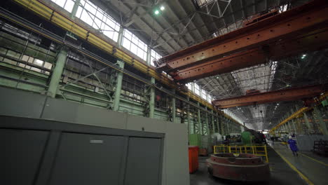 industrial factory interior with cranes and machinery