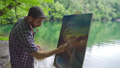 Painter-painting-by-the-lake.