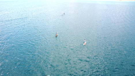 Aerial-view-above-the-paddling-boats-in-the-blue-waters-of-the-Bacalar-lagoon,-in-sunny-Mexico---cenital,-drone-shot
