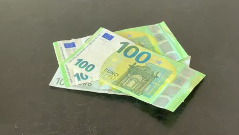 slow motion old and new 100 euro banknotes