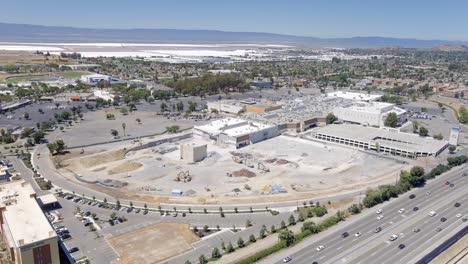 aerial hyper lapse: shopping mall demolished - concept: death of brick and mortar stores, ecommerce, renovation, real estate in california