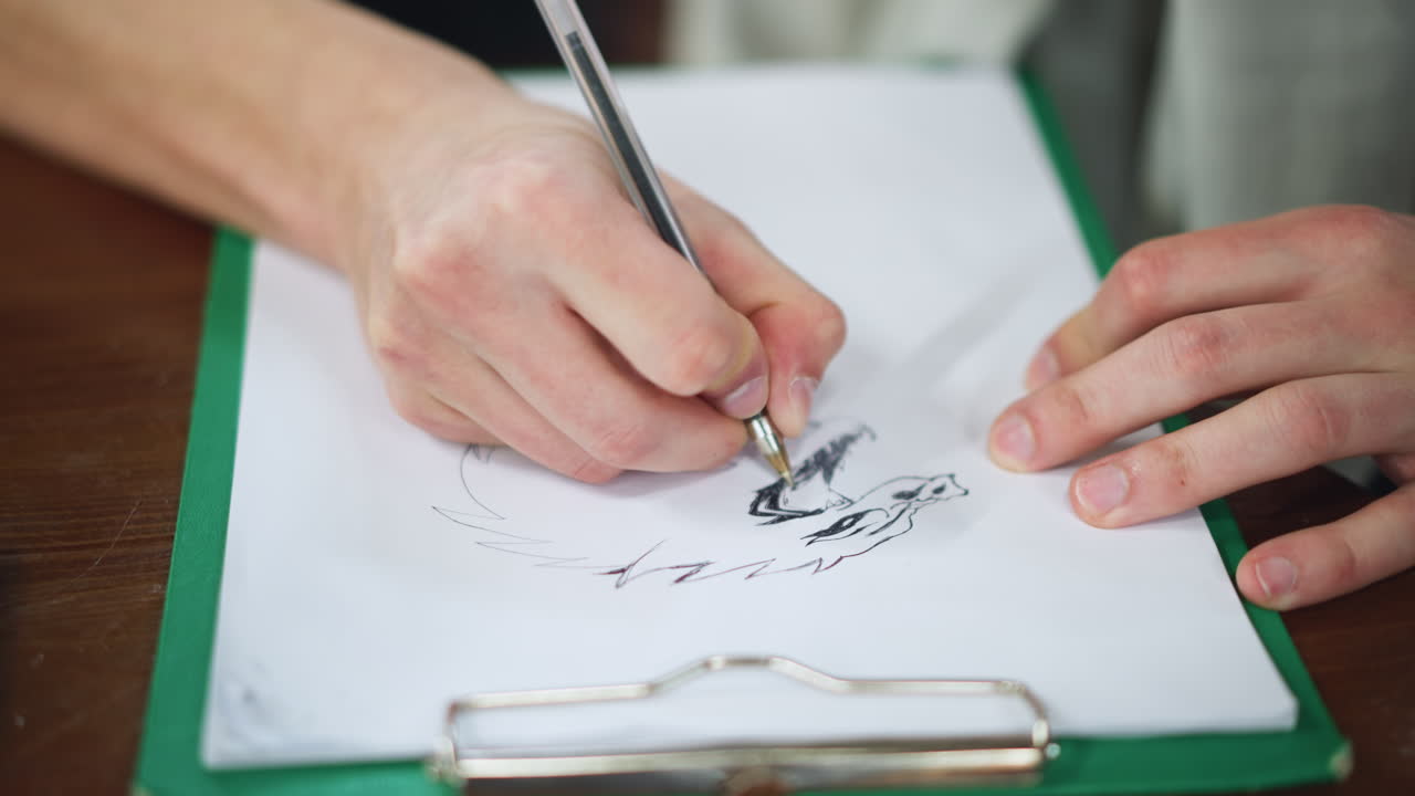 Close up of artist hand sketching detailed animal mouth focusing on tongue texture and teeth shading on textured paper under natural light capturing pencil strokes hand movement creative process
