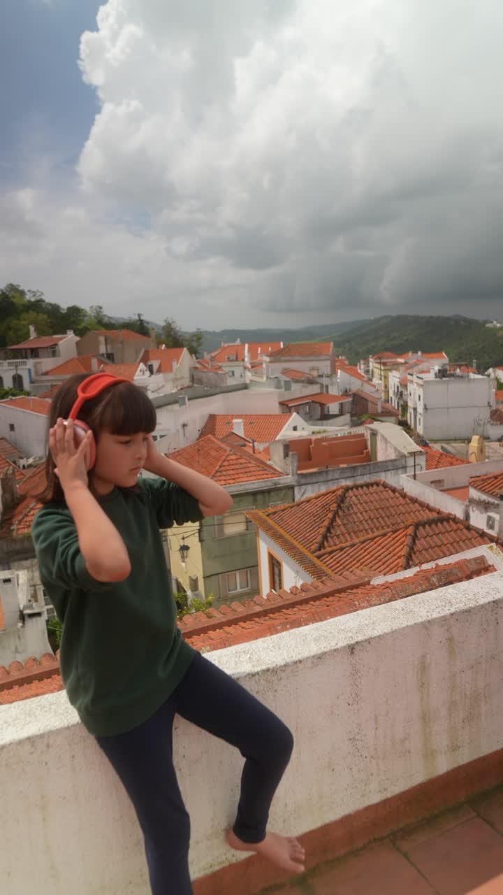 Girl with Headphones on a Rooftop