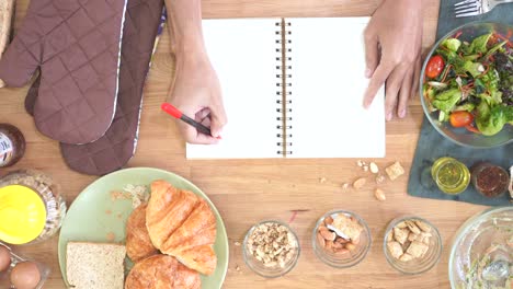 cooking and holding pen and spiral notepad as mockup, top view