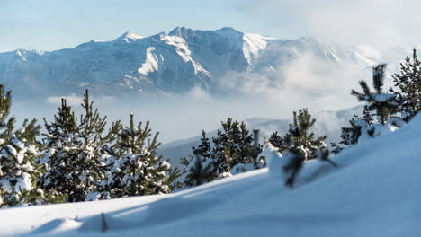 timelapse mountain olympus snow winter sunny trees foreground clouds