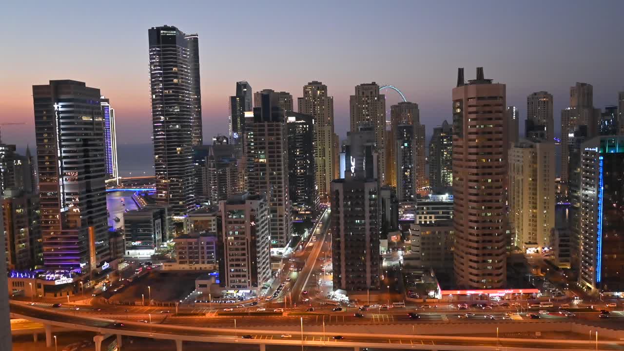 4K: UAE skyscrapers of Dubai Marina district with modern buildings and city traffic