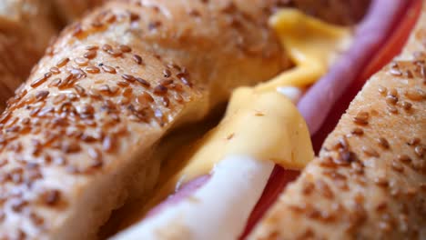 close-up of a delicious ham and cheese bagel sandwich