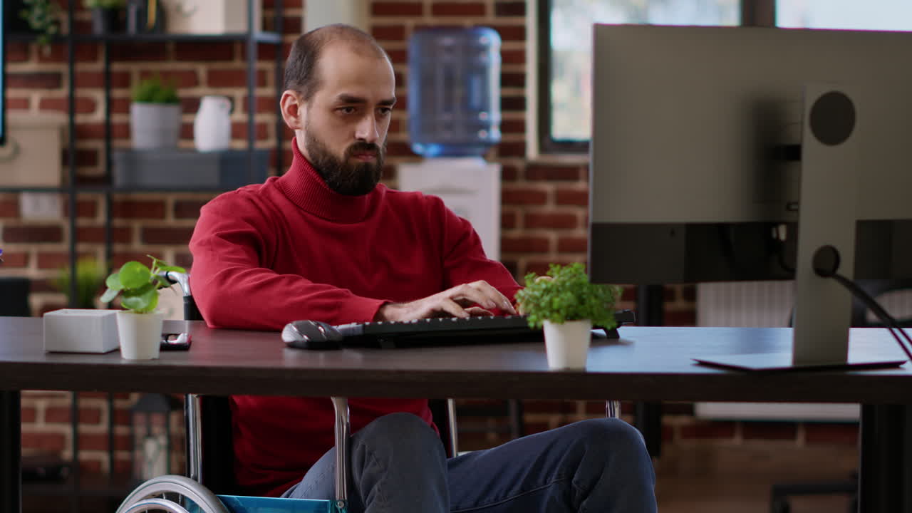 Young entrepreneur using computer to create data charts