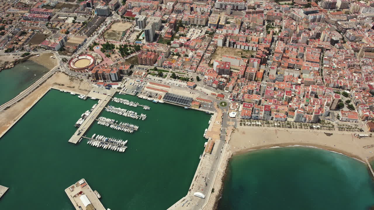 Aerial view of a Mediterranean coastal town and marina