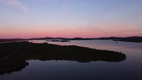 picturesque evening dusk blue hour aerial over calm lake in sweden