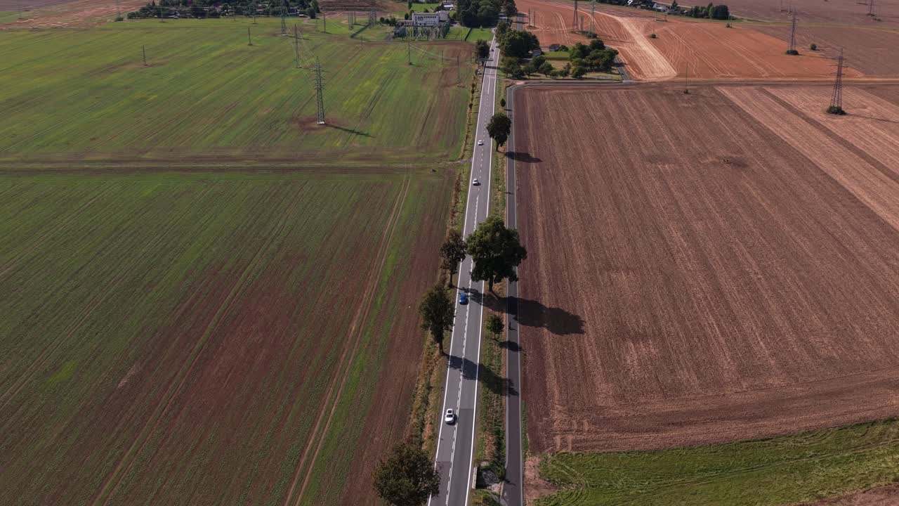 Road with moving cars from drone view. Road to the city of Svitavy in the Czech Republic