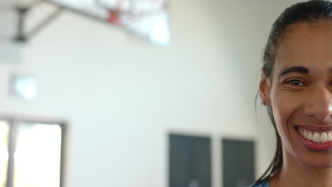 smiling woman in basketball gym, enjoying sports and fitness activities, copy space