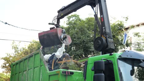 crane operating collecting household waste