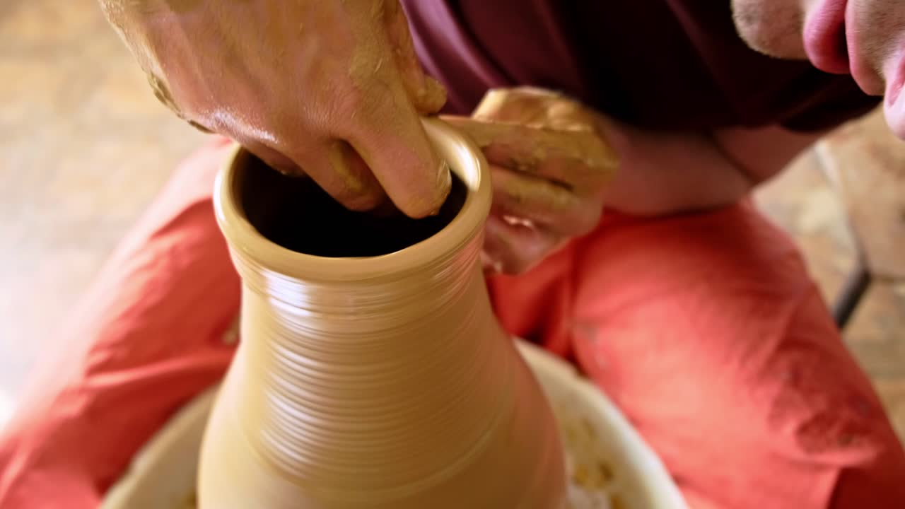 Mastering the Art of Pottery: A Step-by-Step Journey from Clay to a Beautiful Finished Vessel in the Hands of a Skilled Artisan