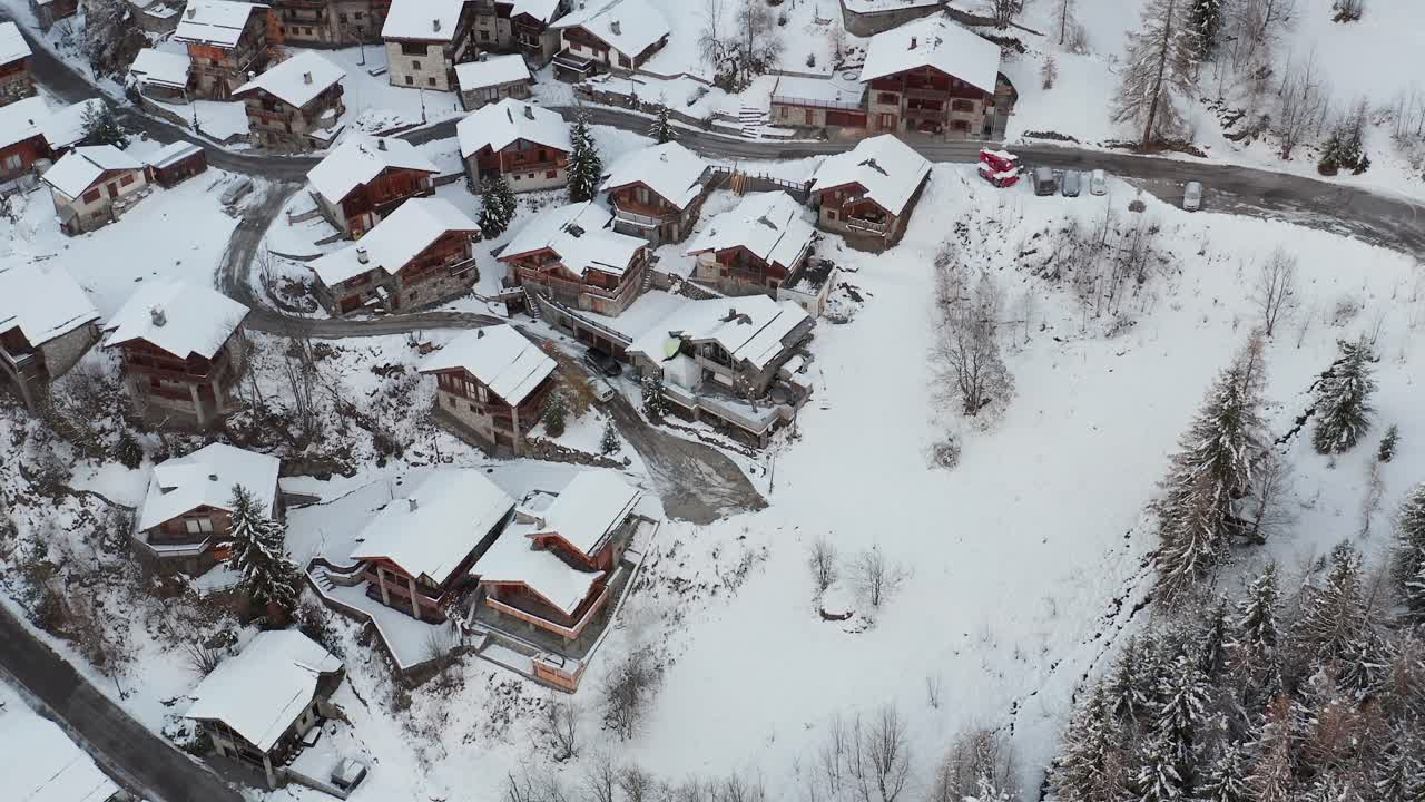 High angle view of wintersport chalets in the French Alps closing in to a chalet
