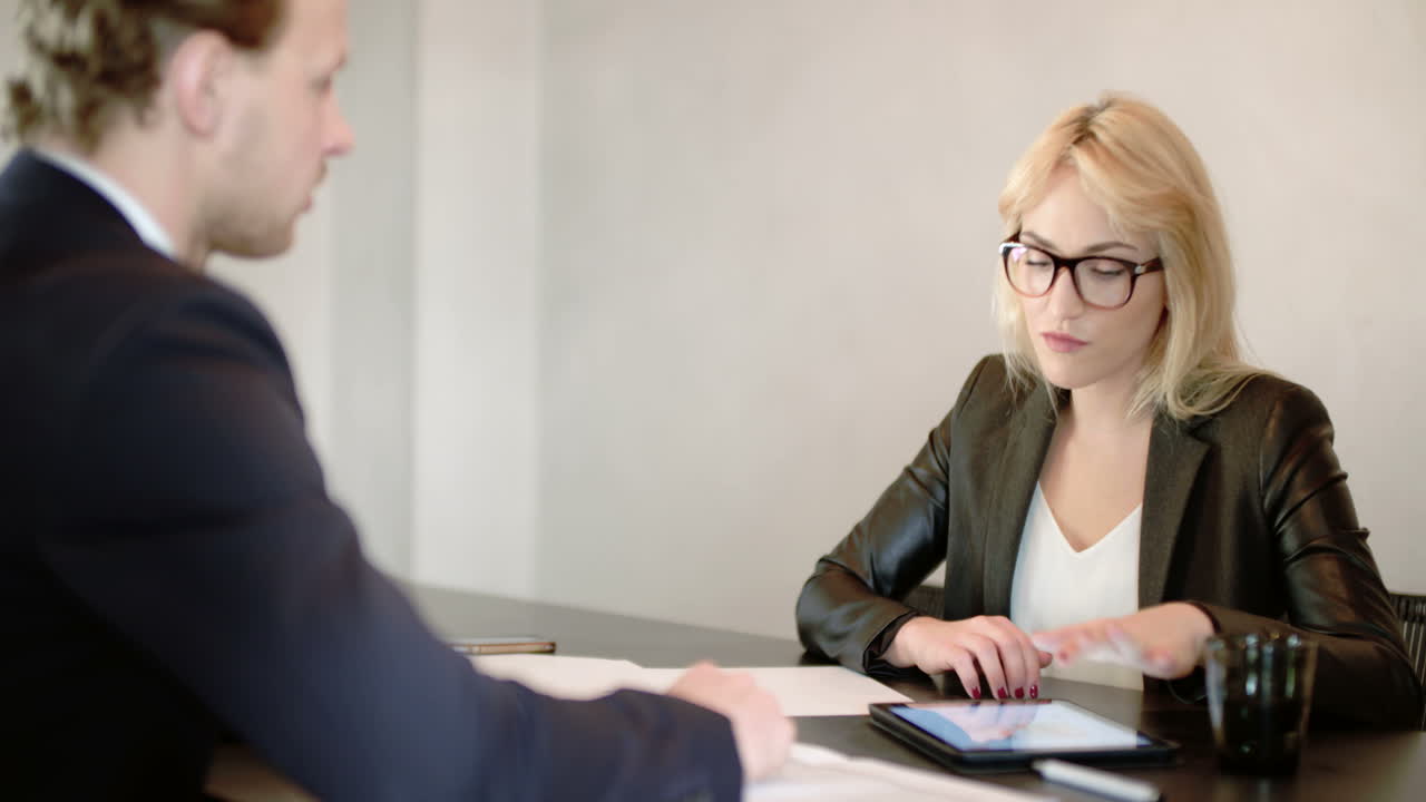 Businesswoman Interviewing Job Applicant