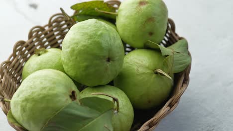 green guavas in a basket